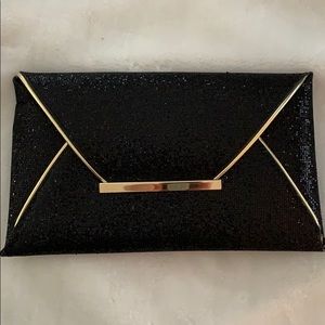 Black and gold glitter clutch